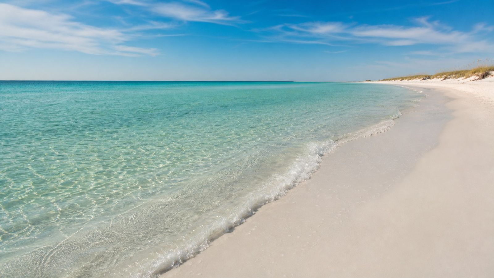Pristine emerald water and white sand at Destin Florida beach on a calm morning