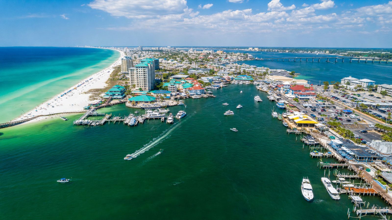 Aerial view of Destin Florida showing HarborWalk Village and the emerald Gulf Coast beaches