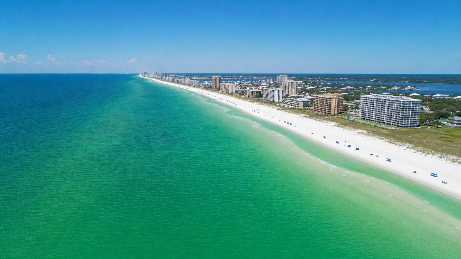 Aerial view of Destin Florida emerald Gulf Coast beach stretching along the Panhandle shoreline