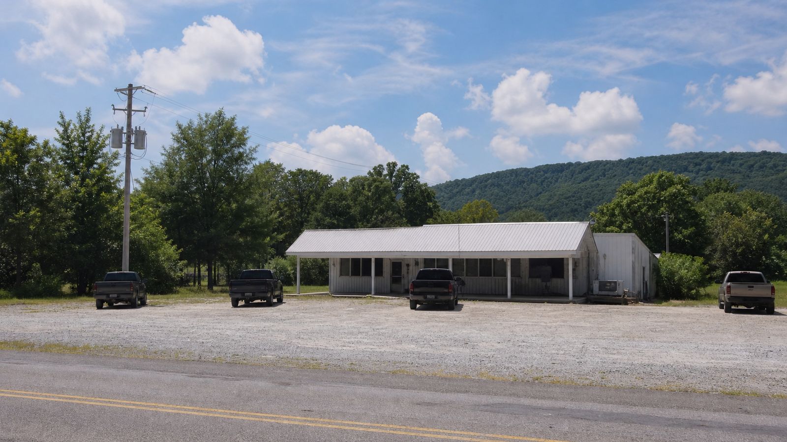 Classic roadside diner in small Alabama town with pickup trucks in the parking lot, a road trip lunch stop in the rural South