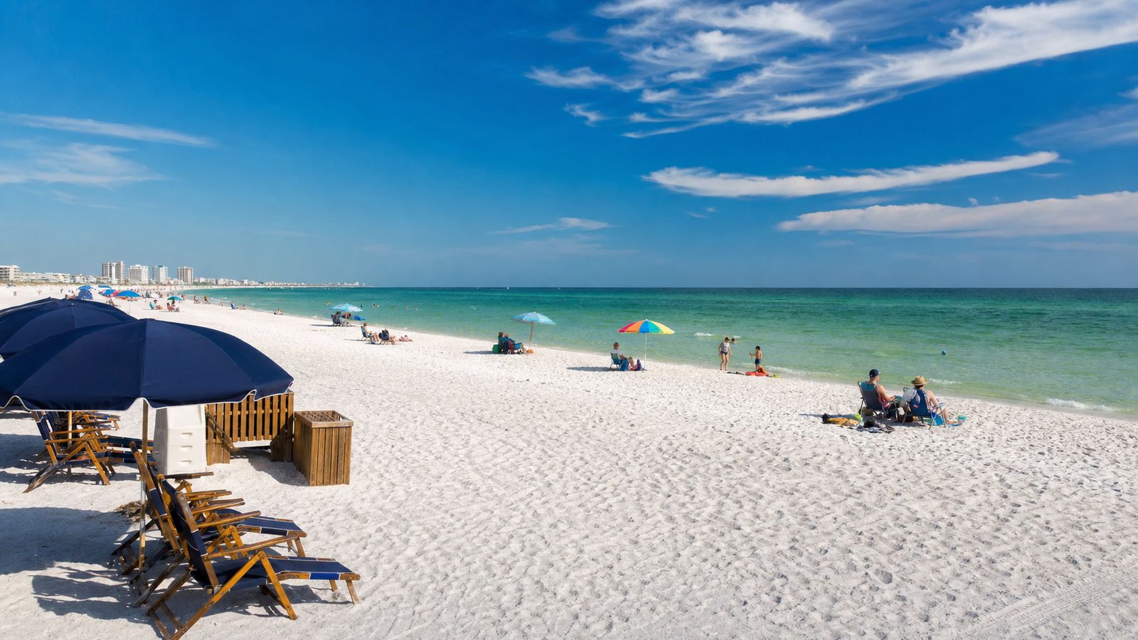 Lightly crowded Destin beach on a warm May morning with emerald Gulf water and plenty of space for beach visitors