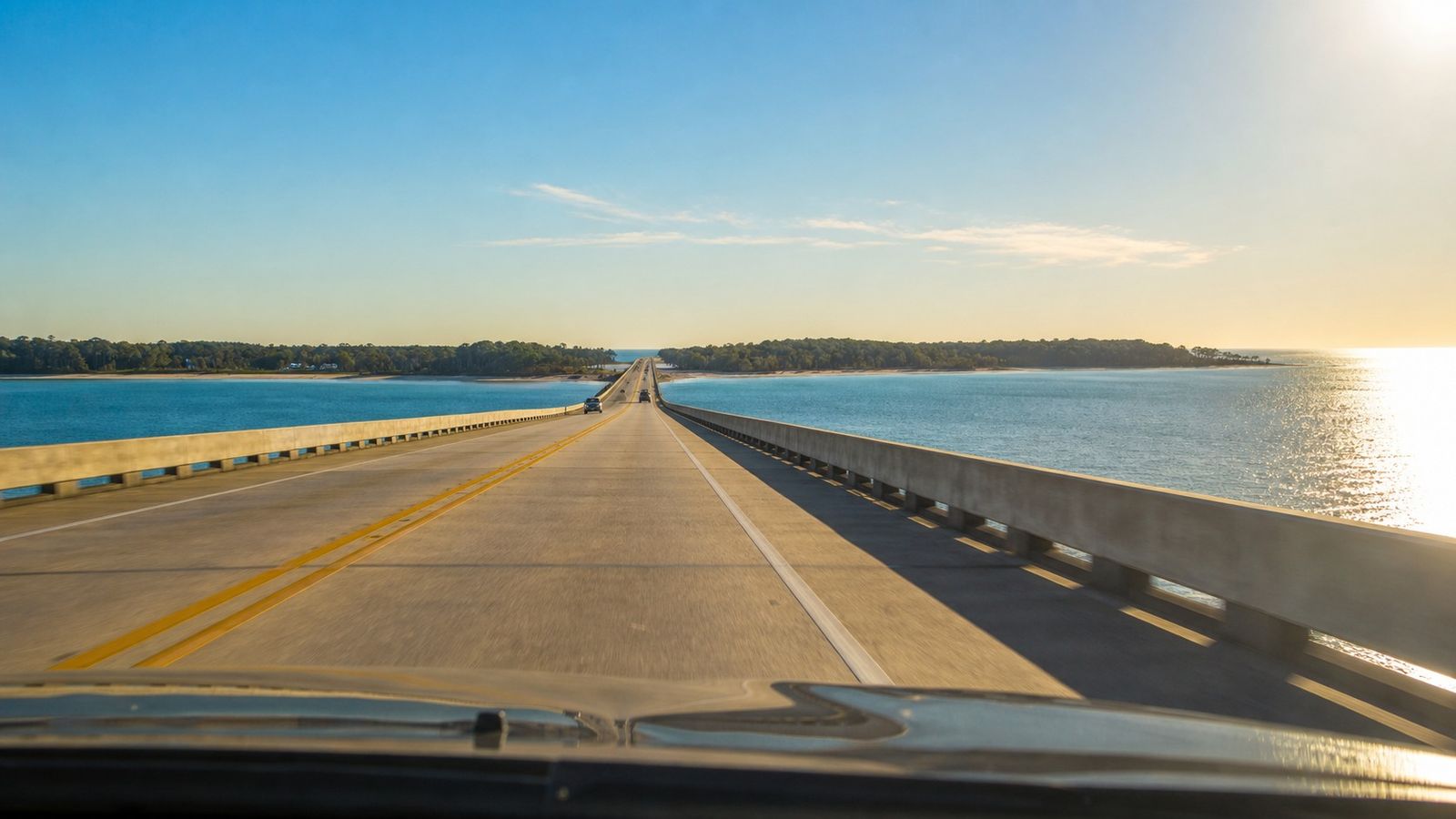 View from a car crossing the Mid-Bay Bridge over Choctawhatchee Bay on the approach to Destin Florida on a clear summer morning