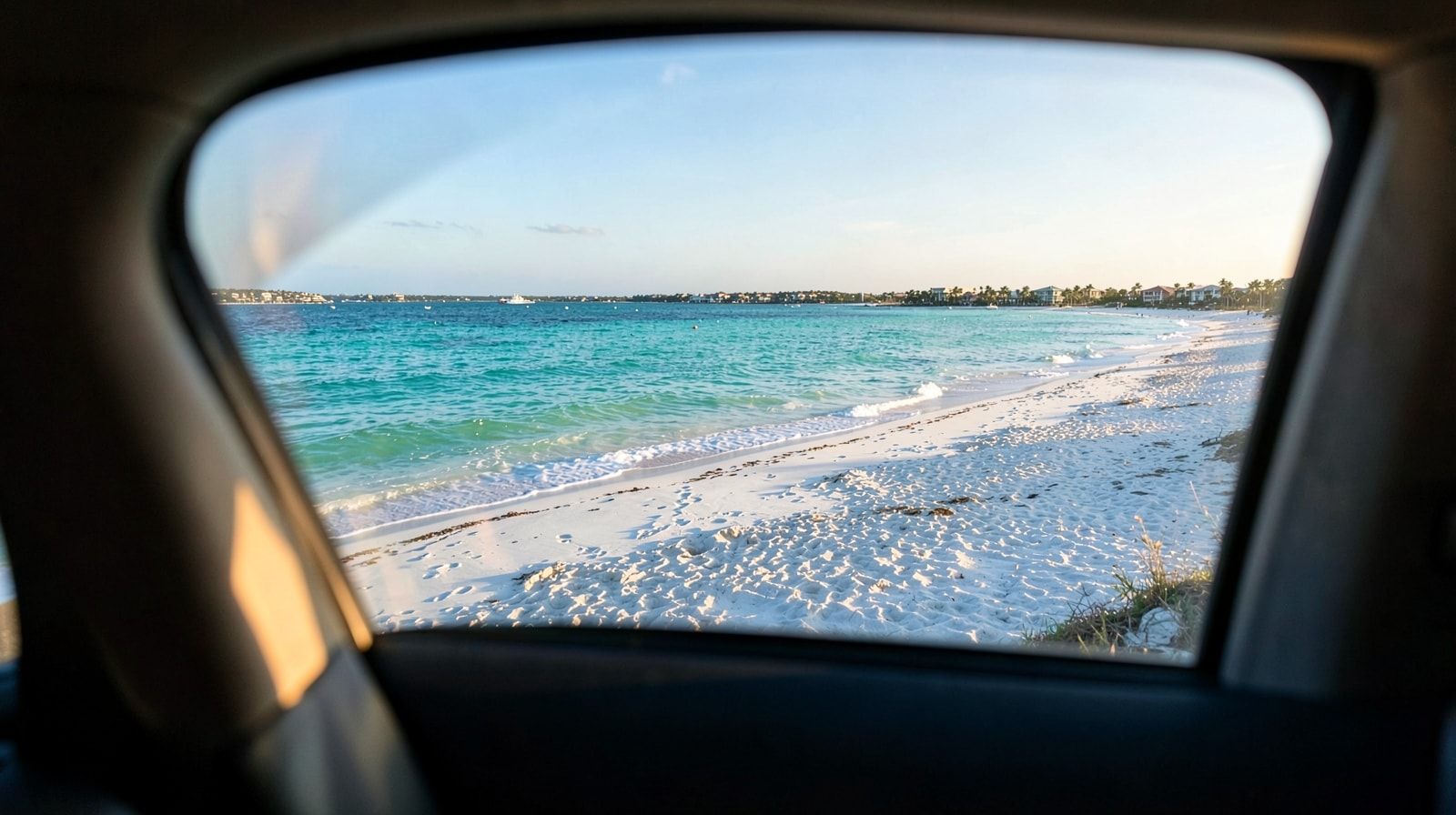 First view of Destin Florida turquoise Gulf water and white sand beach from the car window after the drive from Tulsa
