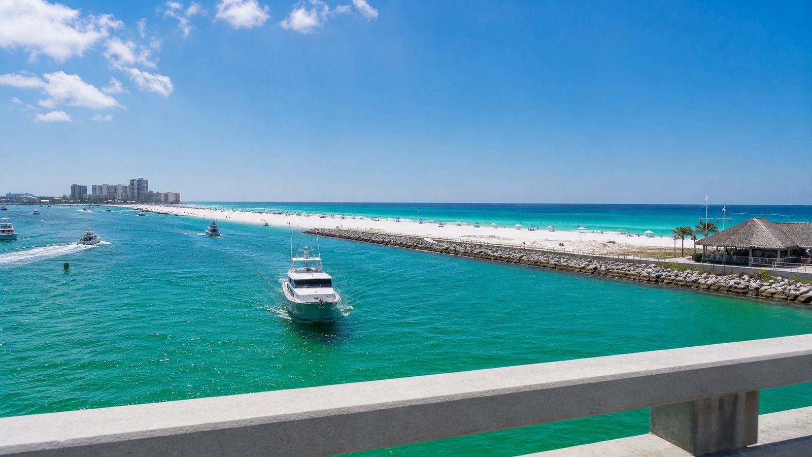 First breathtaking view of Destin's emerald Gulf water and white sand beach from the harbor bridge