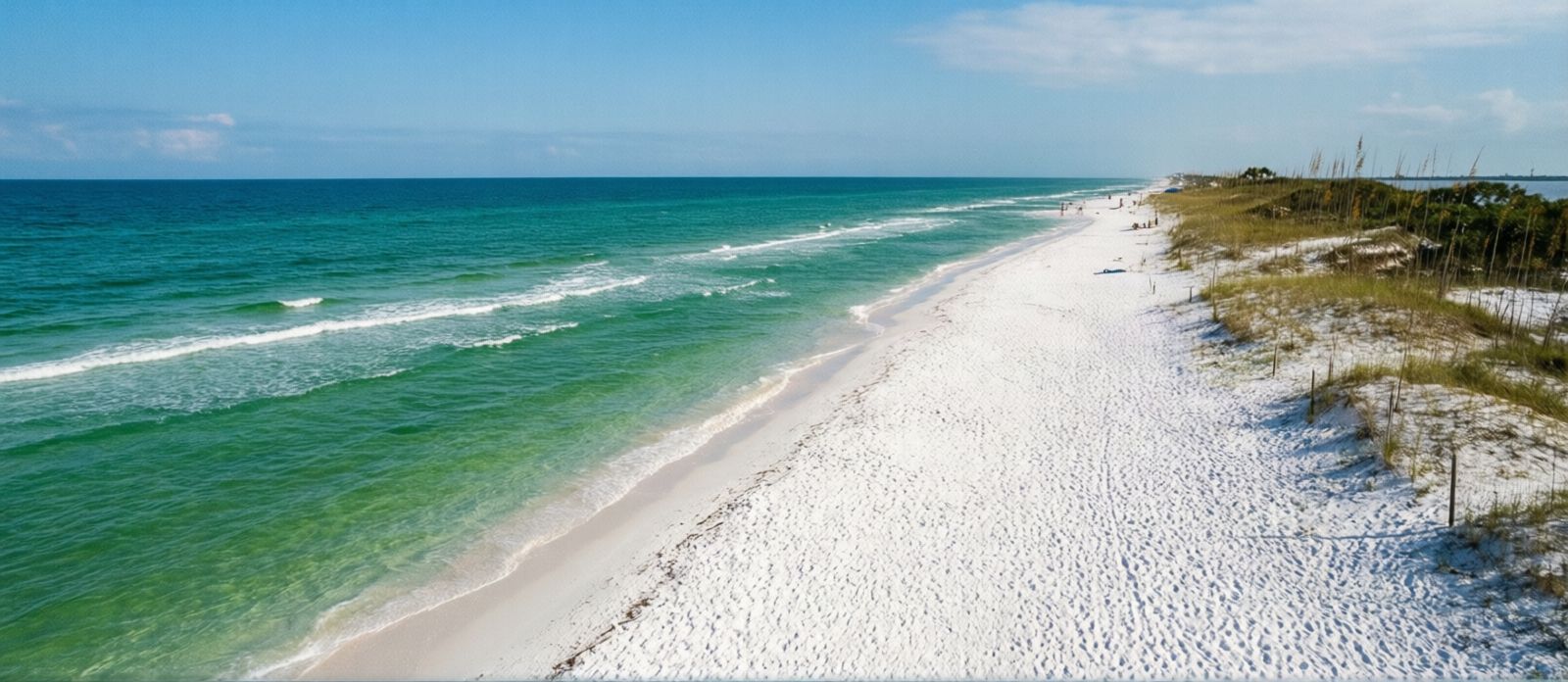 Pristine white sand and turquoise Gulf water at Henderson Beach State Park in Destin Florida with coastal dunes and no development